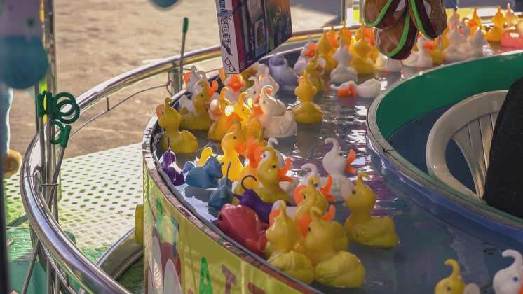 Fairground classic game of rubber ducks hook fishing ROVIGO, ITALY 30 OCTOBER  2021: Cool Rubber